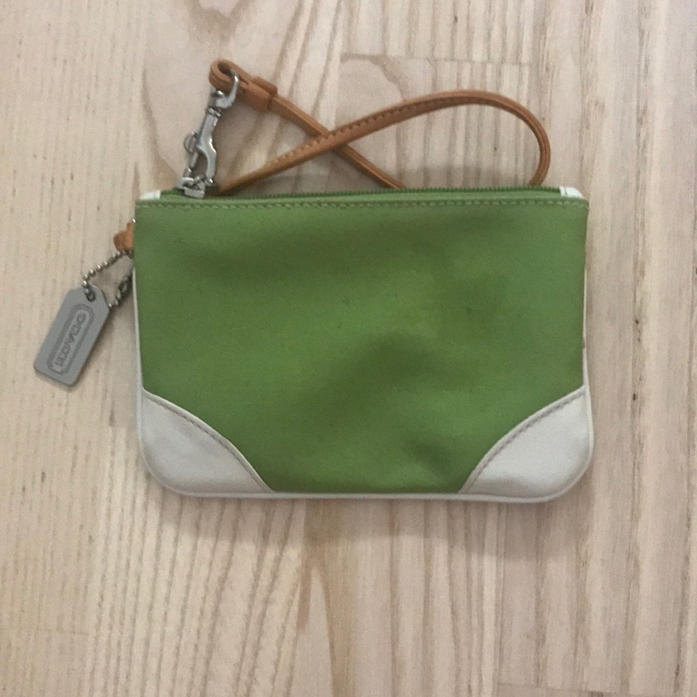 Green and white Coach wristlet.